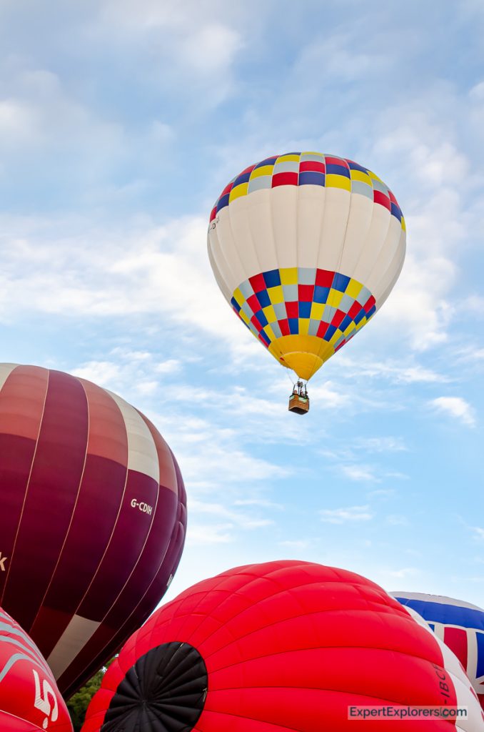 Balloon takes off out of the crowd at the Bristol International Balloon Fiesta