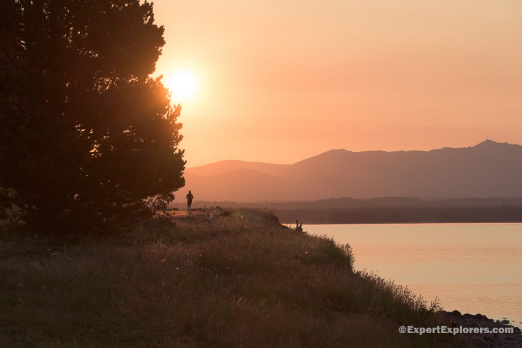 Jogger in morning light, Lake Yellowstone, Yellowstone National Park, Wyoming